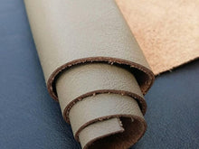 Cargar imagen en el visor de la galería, Rolled leather hide in various colors, chrome tanned cow skins measuring 8 x 11 inches for crafting garments and accessories.