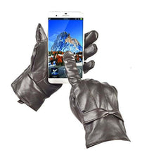 Load image into Gallery viewer, Black women's leather gloves with touchscreen capability holding a smartphone, showcasing warm lining and designer style.