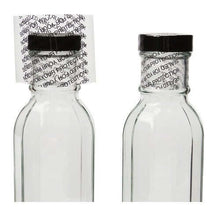 Cargar imagen en el visor de la galería, Clear shrink bands with tamper-evident seal reading 'Sealed for Your Protection' on bottles, securing black caps.