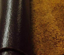 Cargar imagen en el visor de la galería, Close-up of a black leather hide with a chrome tanned finish, ideal for crafts and garments, highlighting texture and quality.