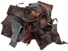 Cargar imagen en el visor de la galería, Assorted black leather scraps, 2-lb pack for crafts; ideal for wallets and jewelry, diverse shapes and sizes from garment cutting.