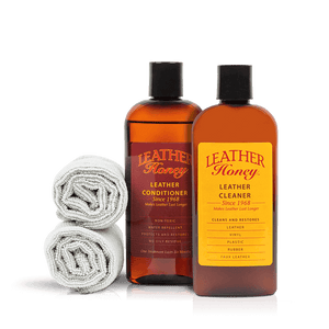 Leather Care Kit with conditioner, cleaner, and cloths for cleaning and conditioning leather goods.