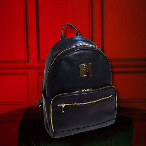 Black leather carrier backpack with gold zippers, perfect for laptop, phone, clothes, and travel essentials.