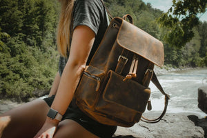 Woman outdoors with The Hagen Backpack | Vintage Leather Backpack in rustic setting