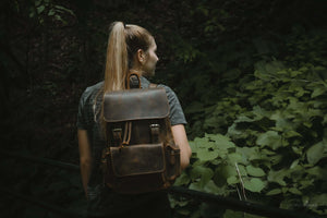 The Hagen Backpack | Vintage Leather Backpack on person in natural forest setting