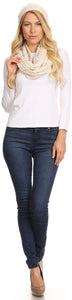 Model wearing Haile woven knit beanie and infinity scarf set in cream, paired with a white top and jeans.