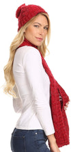 Charger l&#39;image dans la galerie, Woman wearing a red metallic woven beanie and infinity scarf set with a knitted design, perfect for winter fashion.
