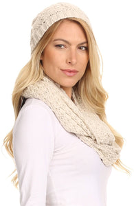 Woman wearing Haile metallic threaded woven beanie and infinity scarf set in cream color.