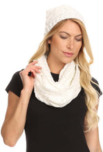 Charger l&#39;image dans la galerie, Woman wearing white Haile Metallic Threaded Woven Beanie and Infinity Scarf Set with knit design and large pom pom.
