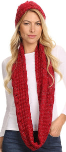 Woman wearing red woven beanie hat and infinity scarf set with metallic threading, showcasing Haile classic knit design.