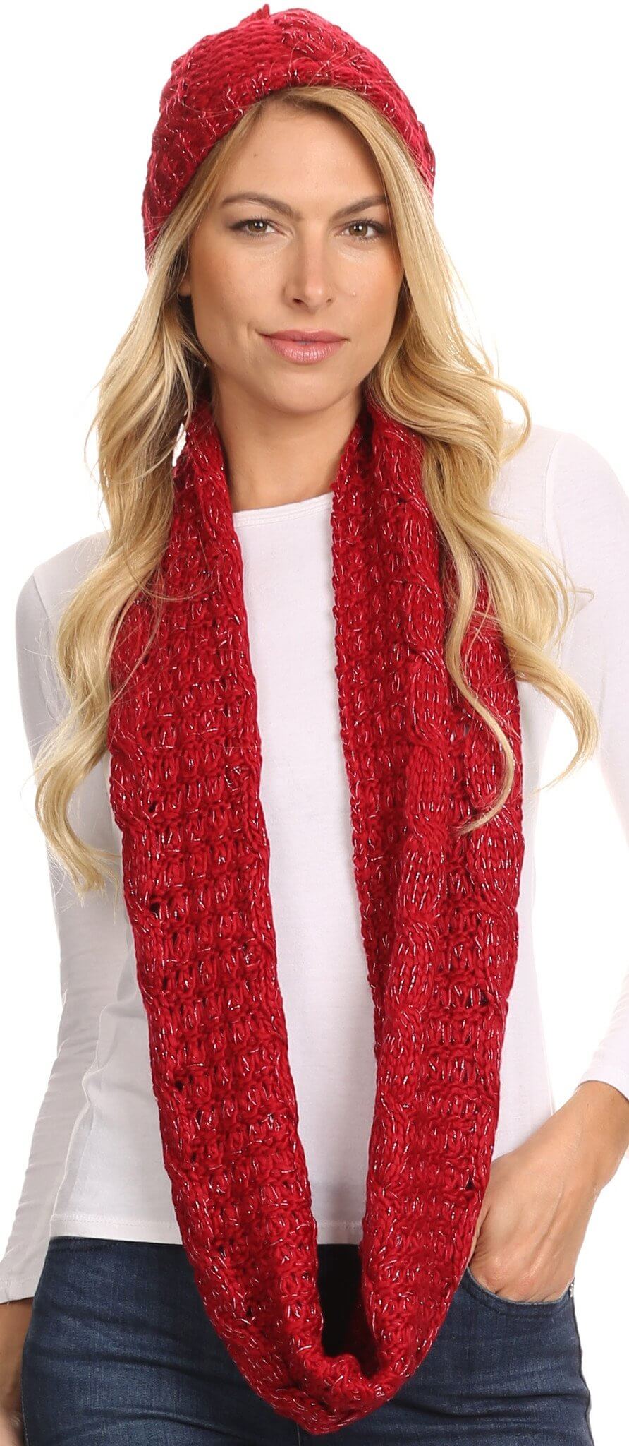 Woman wearing red woven beanie hat and infinity scarf set with metallic threading, showcasing Haile classic knit design.