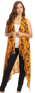 Model wearing Hatice Light Colorful Poncho Wrap Cardigan with African Ankara Print, featuring fringe detail and vibrant design.