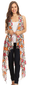 Woman wearing colorful Ankara print poncho wrap cardigan with fringe, perfect for casual wear or festivals. One size light material.