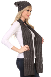 Model wearing Kae jewel-studded cable knit beanie hat and scarf set in dark gray, showcasing slouchy fit and soft acrylic fabric
