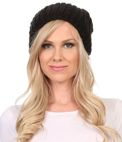 Lax Wide Unisex Cable Knit Beanie Hat with Large Pom Pom in Black, worn by model, showcasing slouchy fit and stylish design.