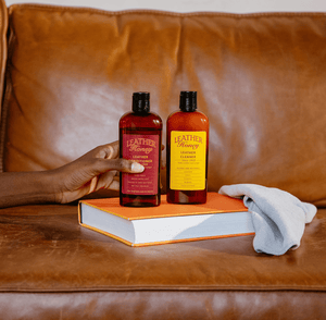 Leather Cleaner by Leather Honey on a leather sofa, ideal for cleaning car seats, jackets, furniture, vinyl, plastic, and more.