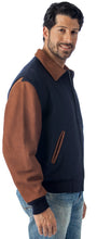 Charger l&#39;image dans la galerie, REED Men&#39;s Executive Varsity Jacket with leather cowhide sleeves and wool body, union made in USA, worn by male model.
