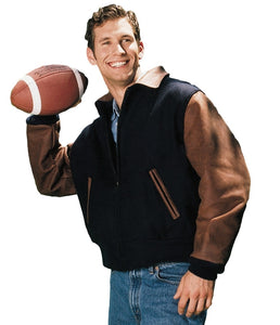 Man wearing REED executive varsity jacket with leather sleeves holding a football