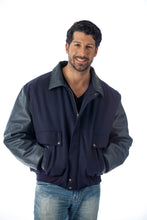 Charger l&#39;image dans la galerie, Man wearing a REED leather varsity bomber jacket, showcasing top grain leather sleeves and collar, made in USA.
