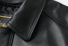 Load image into Gallery viewer, Close-up of REED Men&#39;s genuine leather bomber jacket collar in black, showcasing luxurious texture and craftsmanship.
