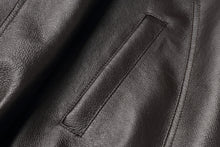 Load image into Gallery viewer, Close-up of genuine leather texture on REED Men&#39;s American Style Bomber Jacket, showcasing sleek and durable design.
