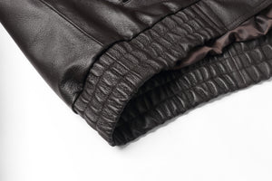 Close-up of the elastic cuff on a REED Men's genuine leather bomber jacket, showing detailed craftsmanship and luxurious material.