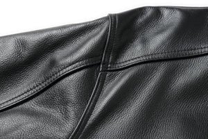 Close-up of REED Men's American Style Bomber Leather Jacket showing genuine leather texture.