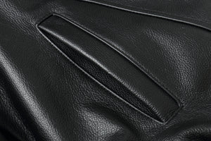 Close-up of genuine leather texture on a REED Men's American Style Bomber Jacket, highlighting its luxurious and durable quality.