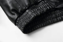Load image into Gallery viewer, Close-up of REED Men&#39;s bomber jacket elastic hem in genuine leather
