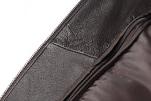 Load image into Gallery viewer, Close-up of REED Men&#39;s American Style Bomber Jacket in genuine leather, featuring a detailed view of the interior lining and zipper.
