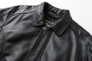 REED Men's American Style Bomber Genuine Leather Jacket, black, close-up view showing luxury and design details.