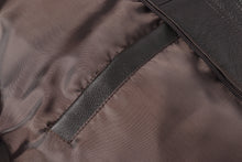 Load image into Gallery viewer, Close-up of REED Men&#39;s American Style Bomber Jacket inner lining and pocket, highlighting genuine leather craftsmanship.
