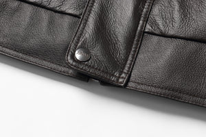 Close-up of REED Men's American Style Bomber Genuine Leather Jacket showcasing luxurious material and stitching detail.