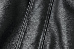 Close-up of genuine leather texture on a REED men's American style bomber jacket.