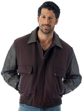 Charger l&#39;image dans la galerie, Men&#39;s leather varsity bomber jacket with wool body and leather sleeves, modeled by a man. Made in USA, classic and stylish design.
