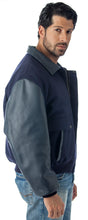 Charger l&#39;image dans la galerie, Man wearing REED leather varsity bomber jacket with wool body, top grain leather sleeves, and collar, made in USA.

