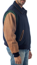 Charger l&#39;image dans la galerie, REED Men&#39;s premium blue leather letterman varsity jacket made in USA, shown on model, showcasing stylish design and quality craftsmanship.
