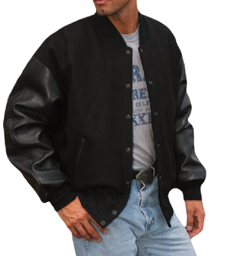 A man wearing a black REED leather premium varsity jacket with a wool body and leather sleeves.