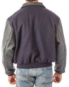 Back view of a REED men's leather varsity bomber jacket with wool body and leather sleeves, made in USA.