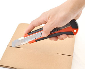 Person using eZthings heavy-duty 9mm snap-off blade cutter on cardboard for cutting materials like wallpaper, vinyl, and leather.
