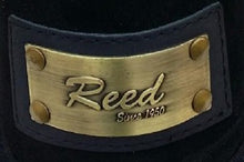 Load image into Gallery viewer, Close-up of Reed brand metal label on leather product, showcasing antique finish and craftsmanship.

