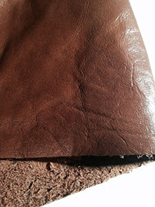 Close-up of REED leather hide, whole skin in rich brown color, showcasing soft, durable texture with antique finish, ideal for crafts.
