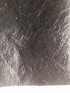 Close-up of REED leather hide showing soft, durable texture and antique finish, perfect for crafting art pieces.