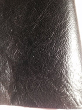 Load image into Gallery viewer, Close-up of REED leather hide in black, soft sheepskin with an antique finish, ideal for crafting unique art pieces, 7 to 10 SF.

